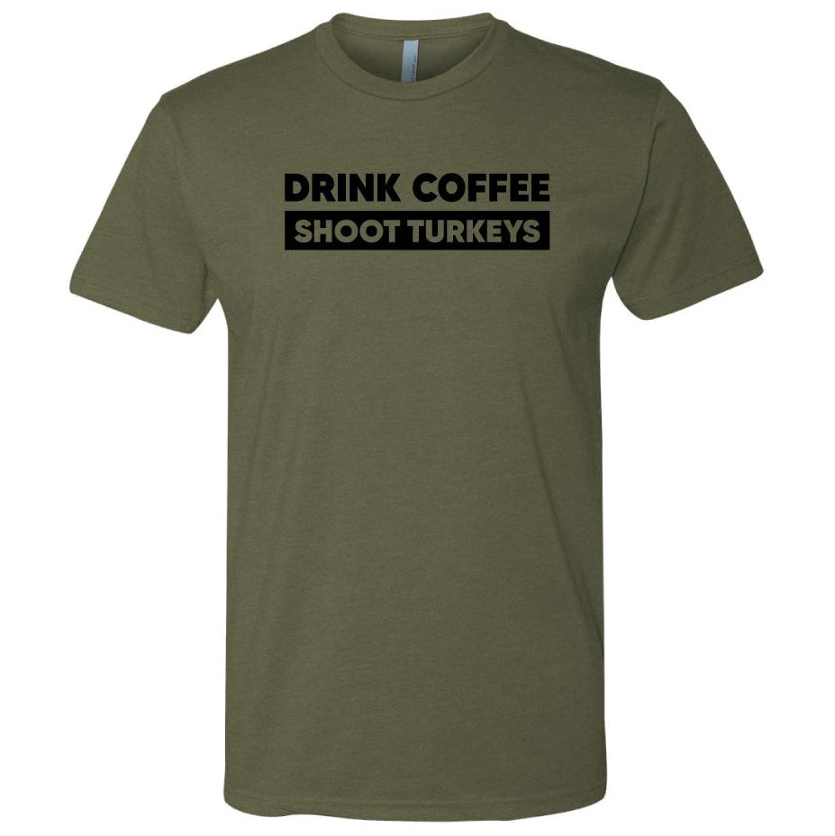 An olive green short-sleeve t-shirt with a black graphic text print on the chest that reads 'DRINK COFFEE SHOOT TURKEYS'. The t-shirt is displayed on a clean white background.