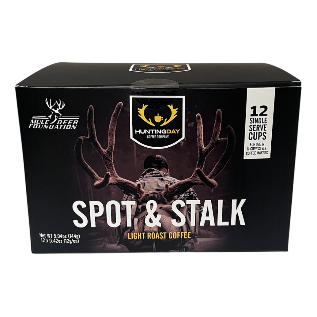 A box of HunterQuay Spot & Stalk Light Roast Coffee, featuring a black background with a deer silhouette and antlers, and white text.