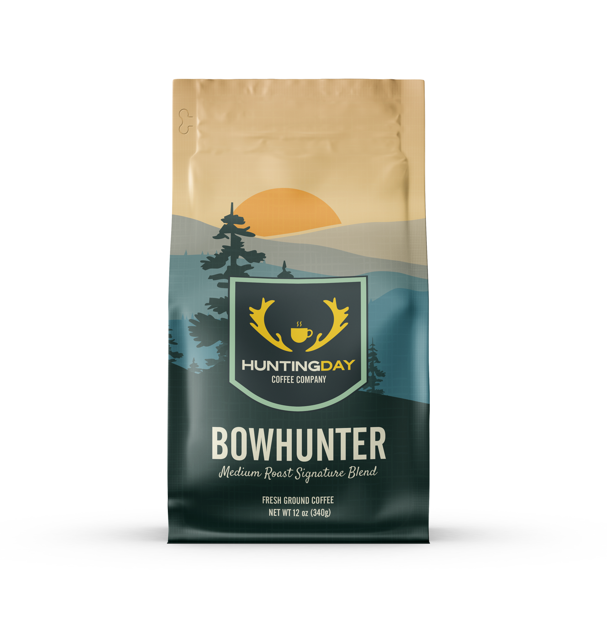 A bag of Huntingday Coffee Company 'Bowhunter' medium roast coffee, featuring a landscape design with a golden sun, pine trees, and a dark teal mountain range.
