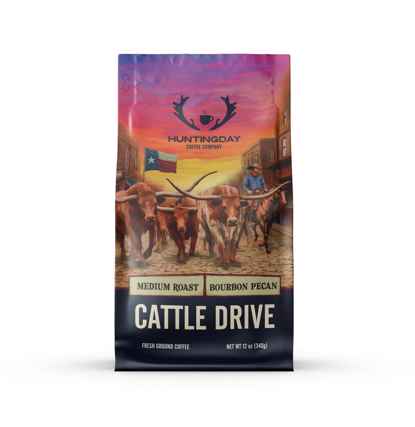 A 12 oz bag of Huntingday Coffee Company Cattle Drive medium roast coffee, featuring a colorful graphic illustration of longhorn cattle on a cobblestone street with a cowboy riding behind them under a sunset sky.
