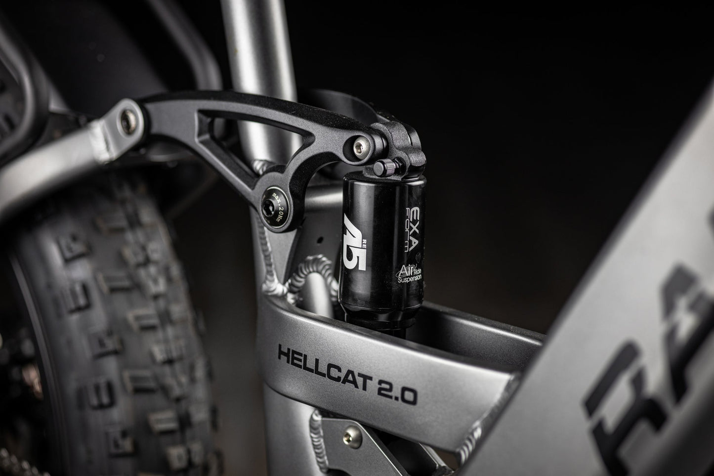 Close-up of a motorcycle suspension system with 'Hellcat 2.0' branding.