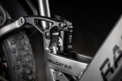 Close-up of a motorcycle suspension system with 'Hellcat 2.0' branding.