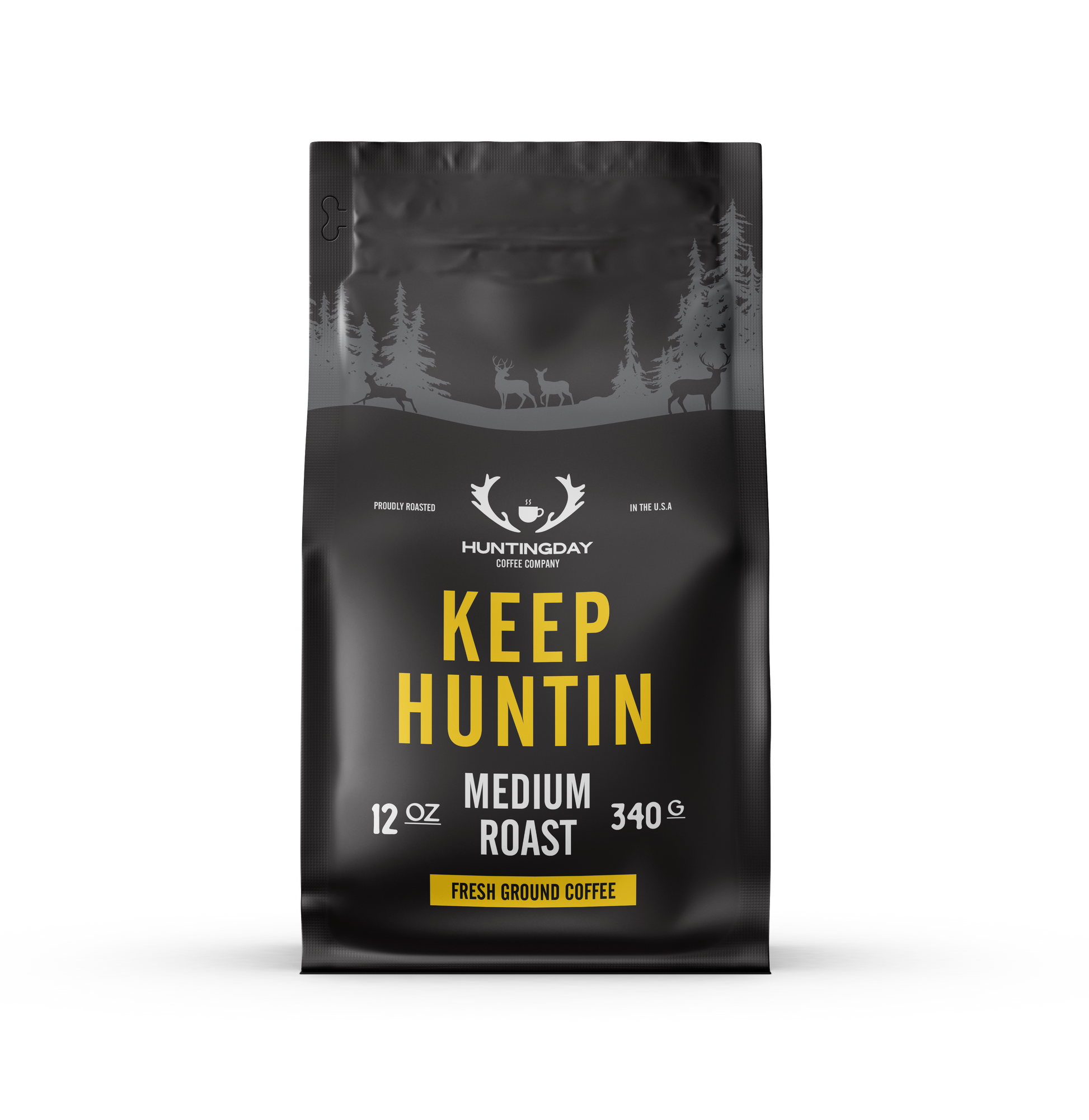 A 340g bag of Huntingday Coffee Company 'Keep Huntin' Medium Roast' coffee. The packaging is matte black with a gray forest and deer silhouette at the top, and features 'KEEP HUNTIN' in bold yellow text with 'MEDIUM ROAST' and 'FRESH GROUND COFFEE' in white and yellow below.