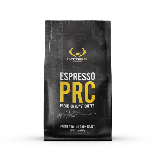 A black bag of Huntingday PRC Espresso Precision Roast Coffee, featuring a dark textured background with faint rifle line art and bold yellow and white text, set against a plain white background.