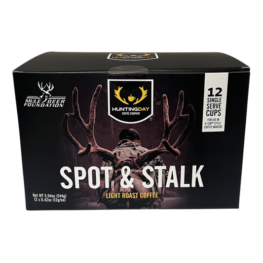A box of HunterQuay Spot & Stalk Light Roast Coffee, featuring a black background with a deer silhouette and antlers, and white text.